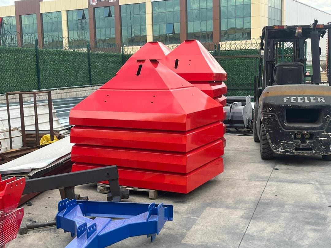 Fertilizer spreader hoppers stacked in the warehouse