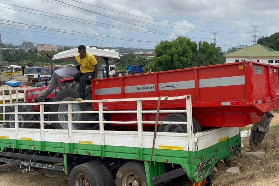 Loading a tractor for delivery in Ghana
