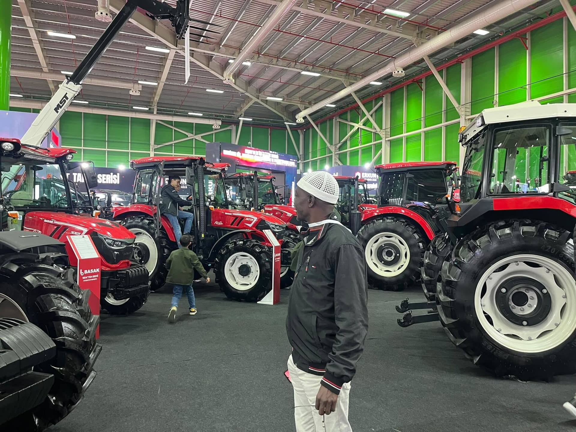 Laluna Enterprise reviewing tractors at an international agricultural machinery exhibition