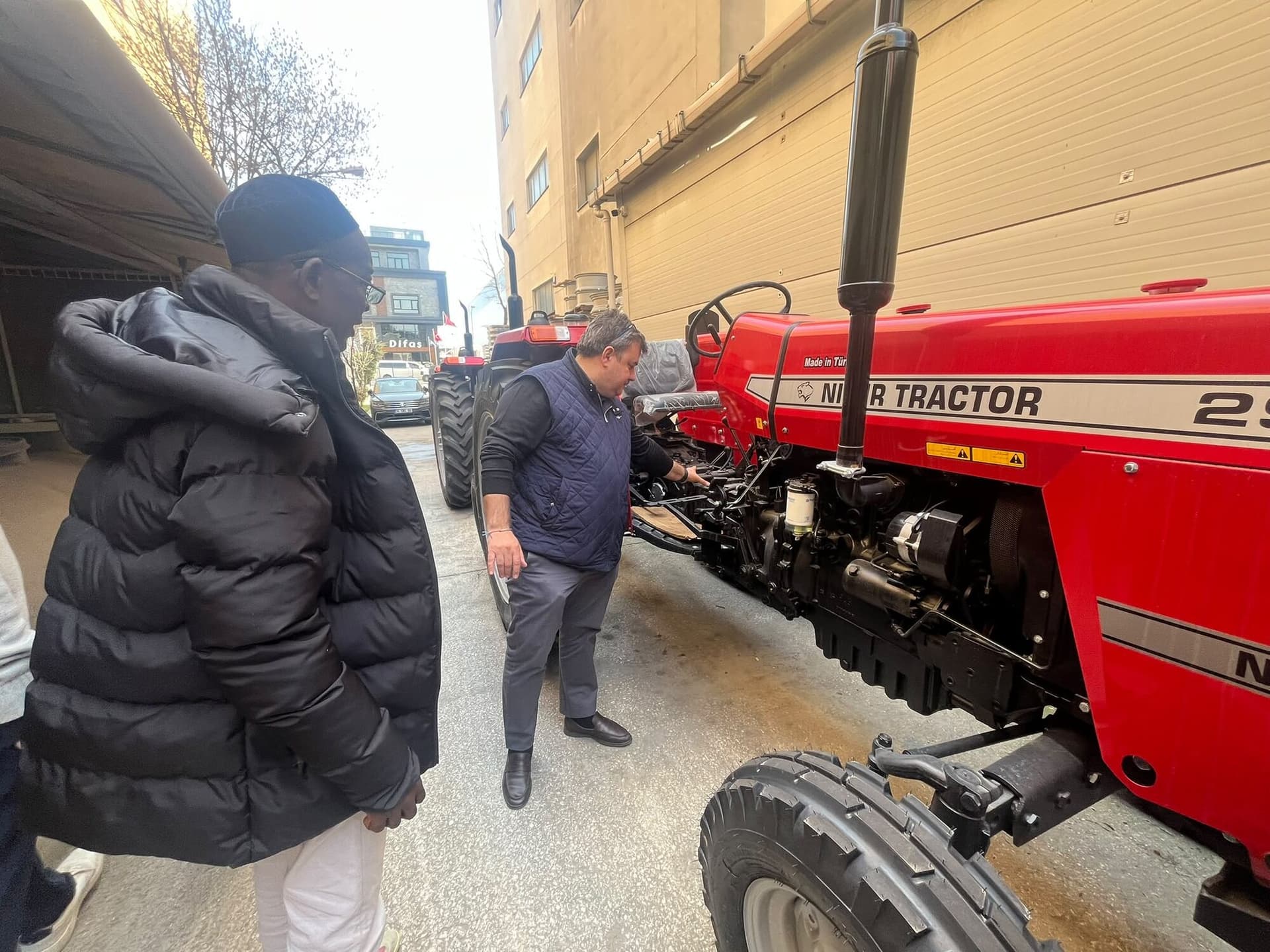 Laluna Enterprise inspecting a tractor during an international sourcing visit