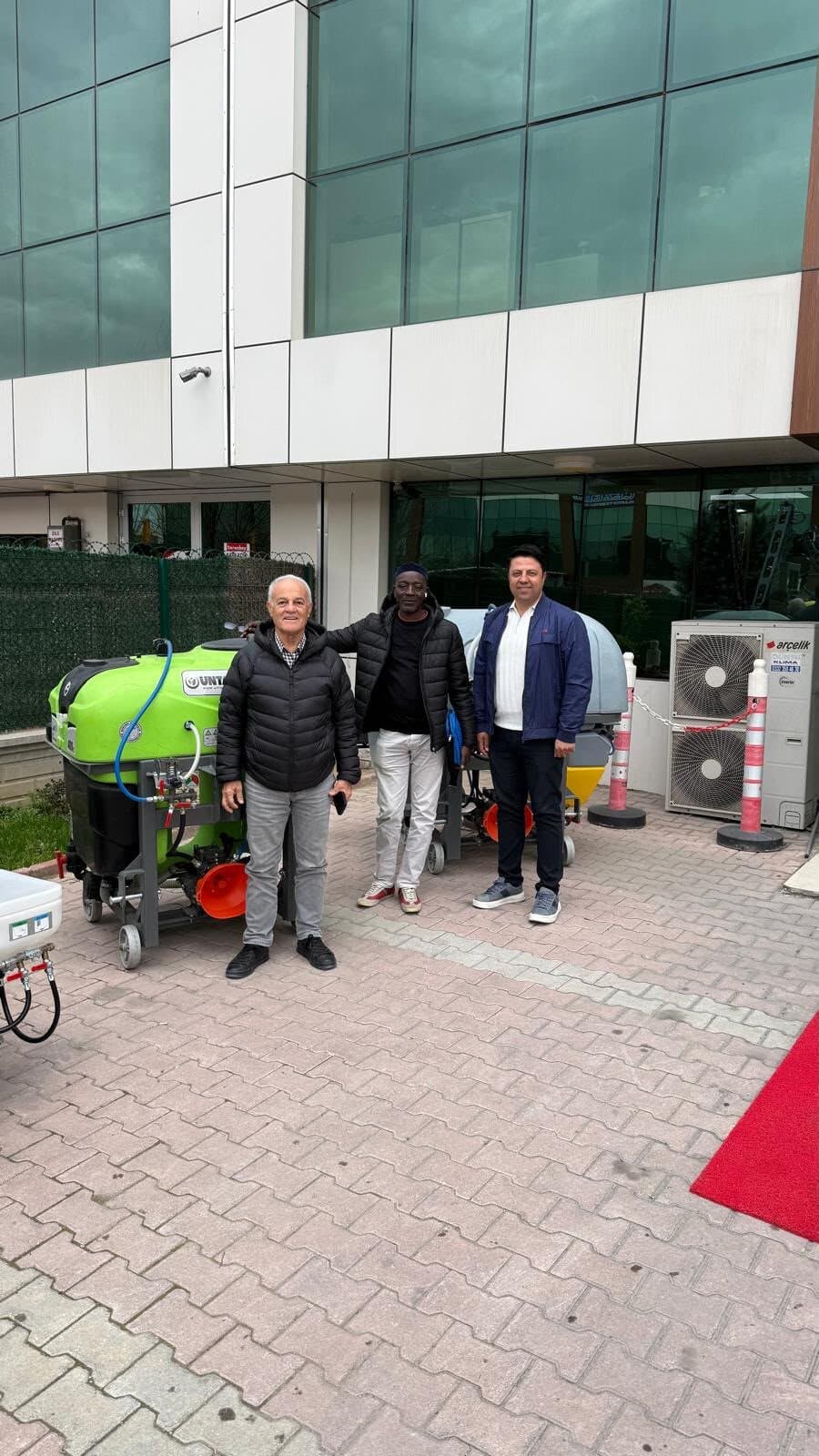 Laluna Enterprise with suppliers alongside crop sprayers