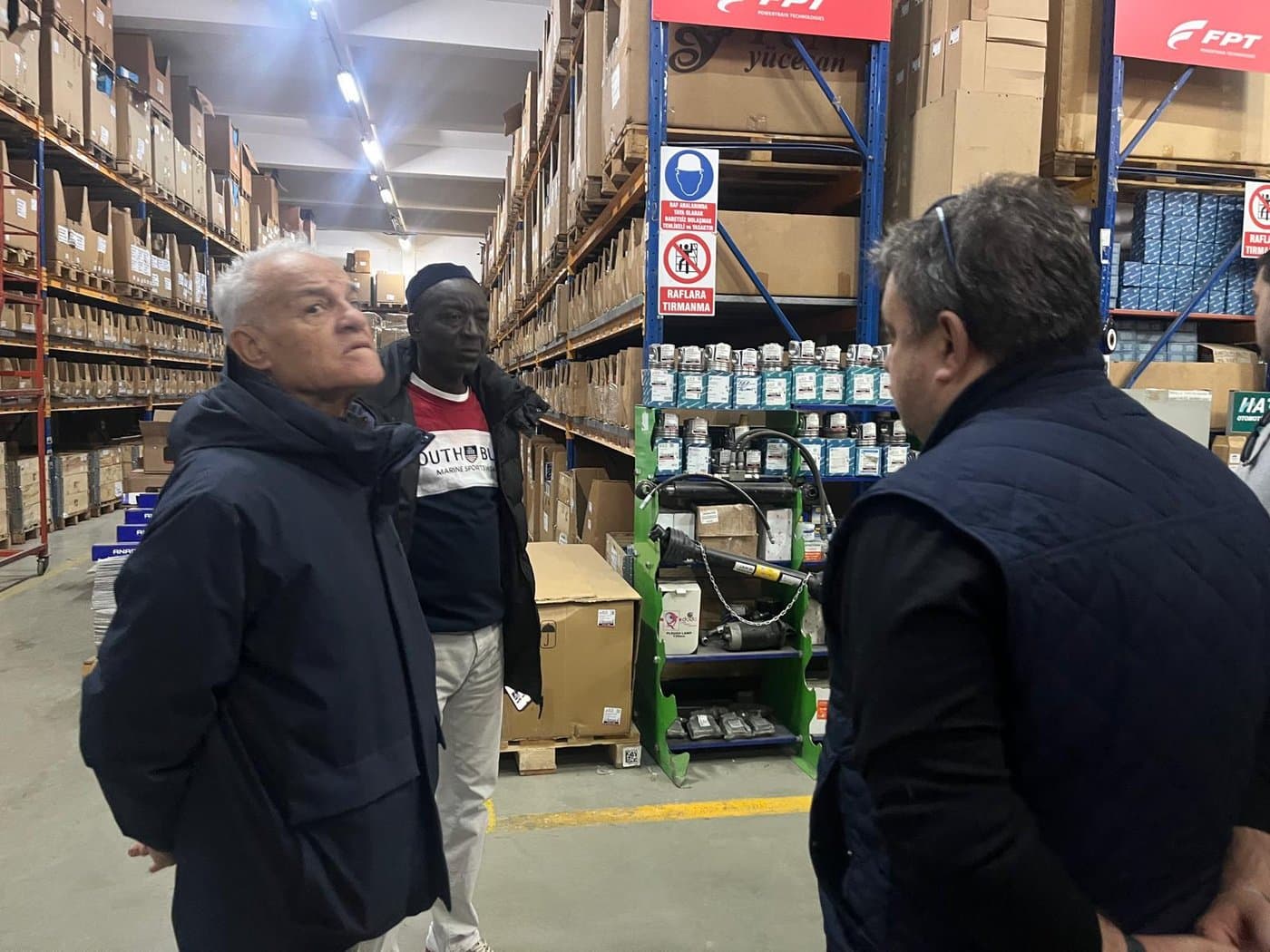 Reviewing stock at a genuine parts supplier's warehouse