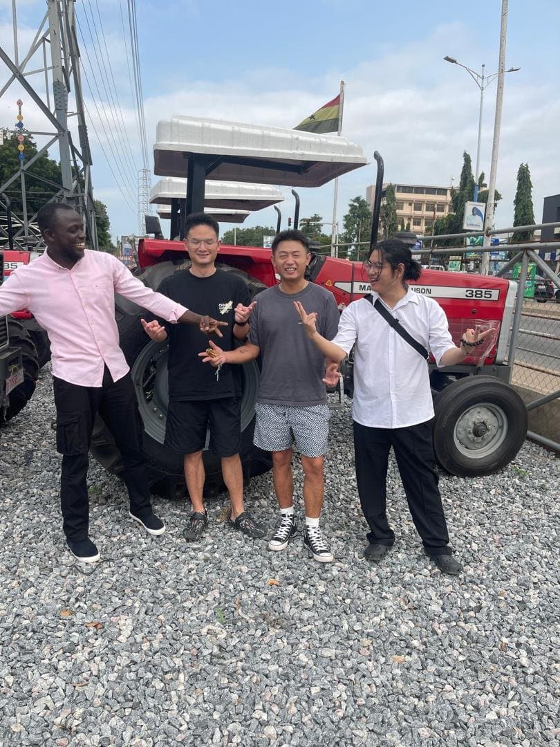 Laluna Enterprise team with partners beside a tractor
