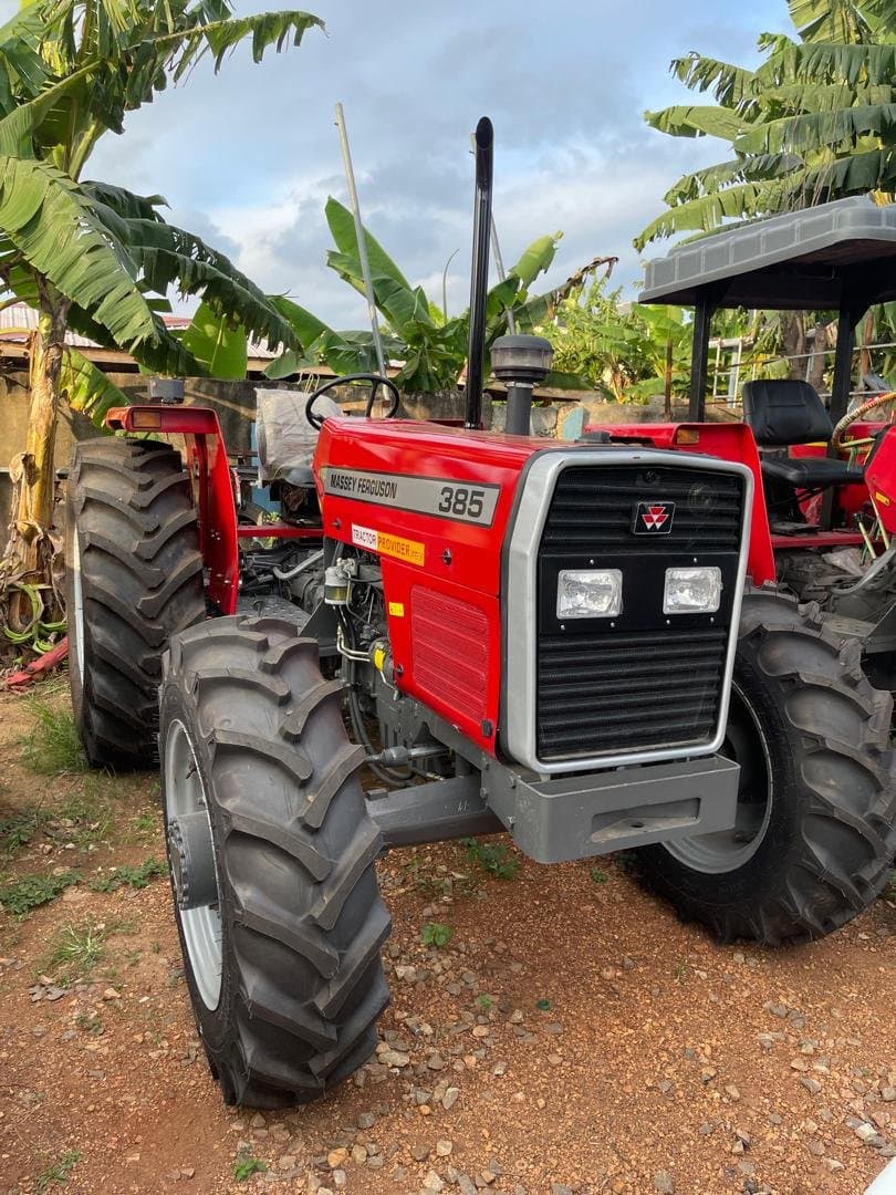 Massey Ferguson 385 tractor in a rural yard setting