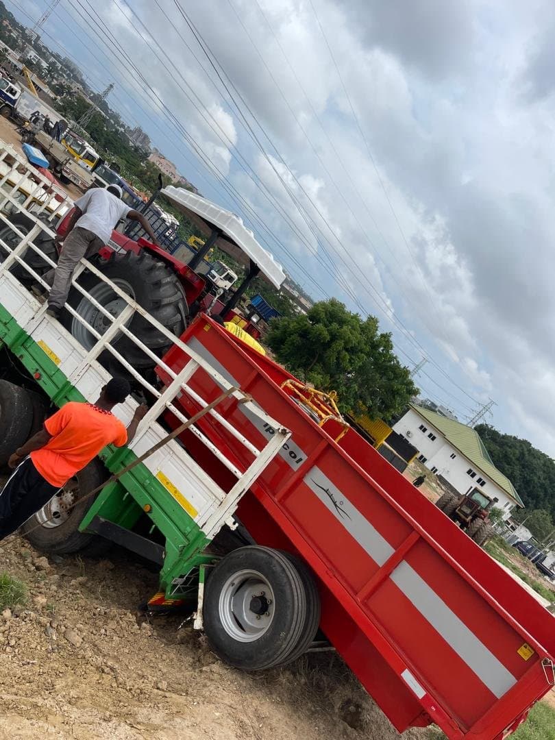 Worker helping load a trailer for delivery