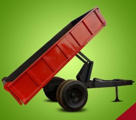 Studio product photo of a tipping farm trailer