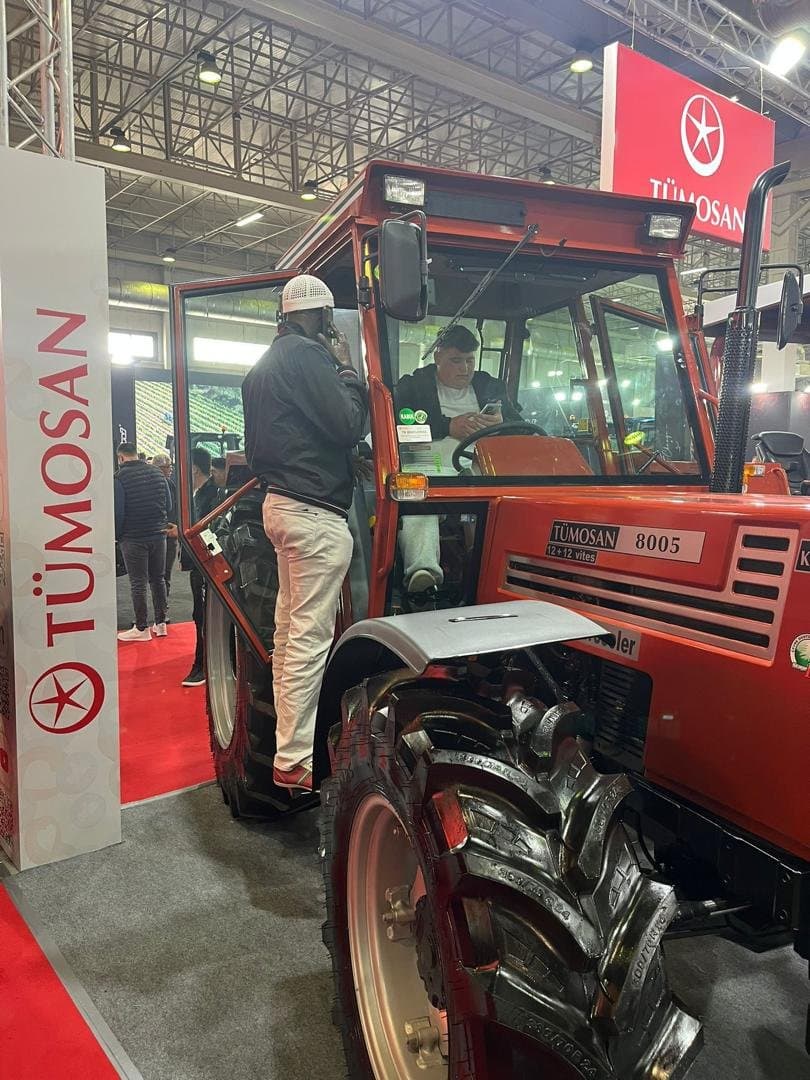 Reviewing a tractor cab at an international agricultural machinery exhibition